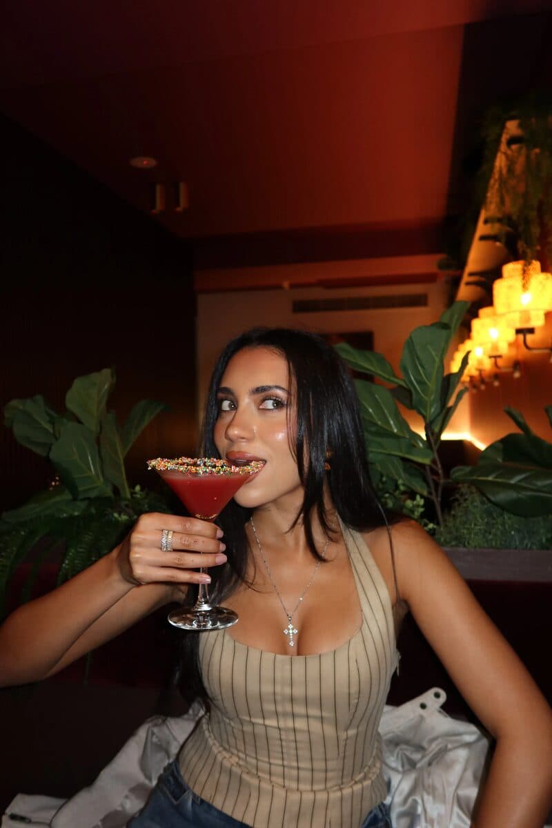 Member with a cocktail on a night out
